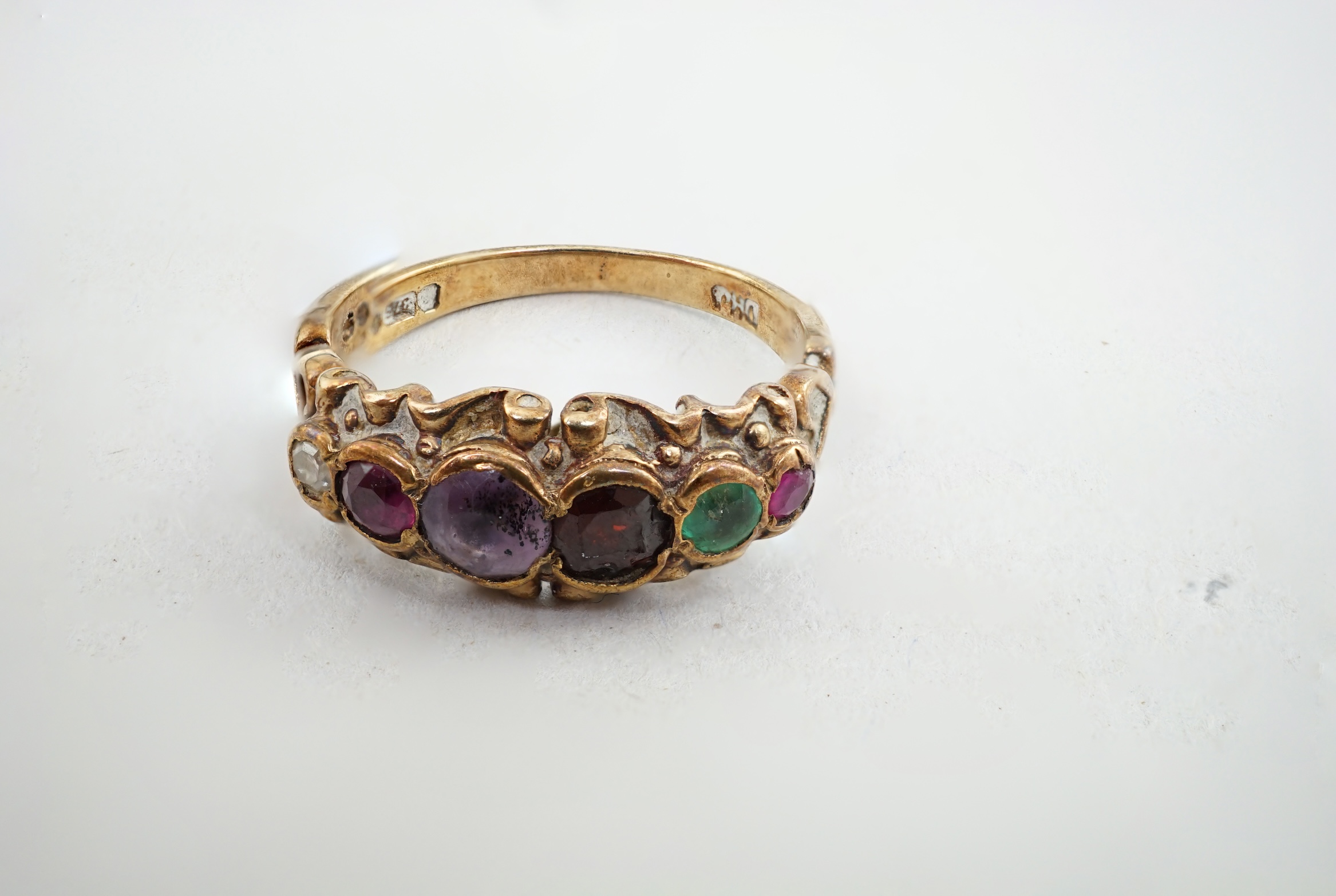 A 1970's Victorian style 9ct gold and gem set 'Regard' half hoop ring